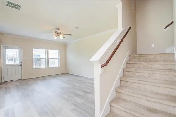 a view of an entryway with wooden floor