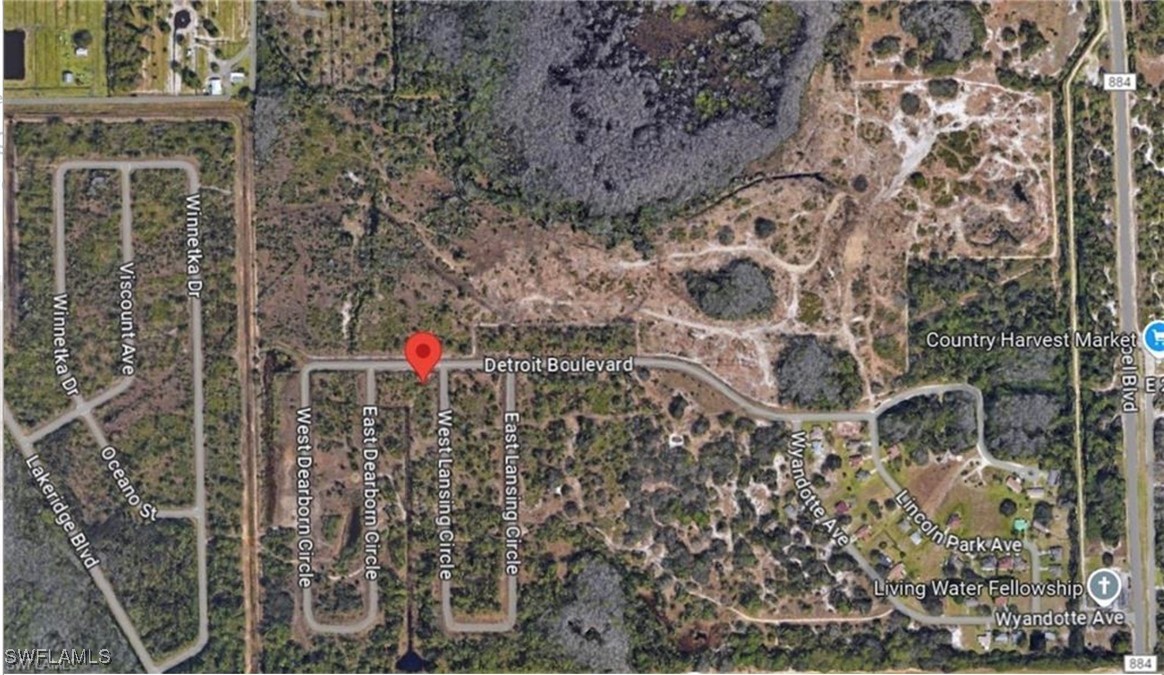 2084 West Lansing Circle Alva, FL 33920 - Photo 3 of 5 view of a brick building