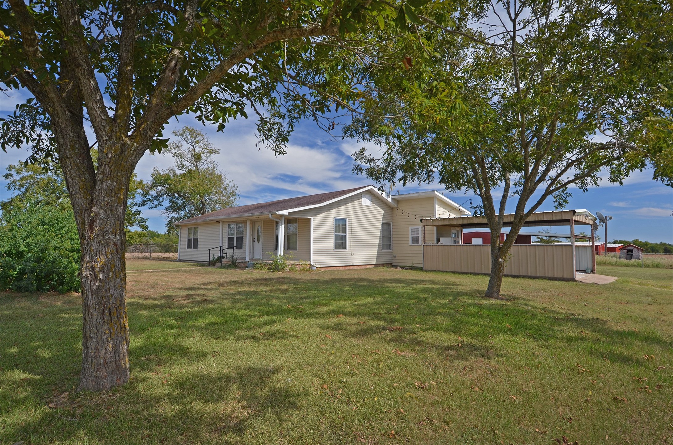 2352 Airport Road Brenham, TX 77833 - Photo 5 of 26 a house with trees in the background