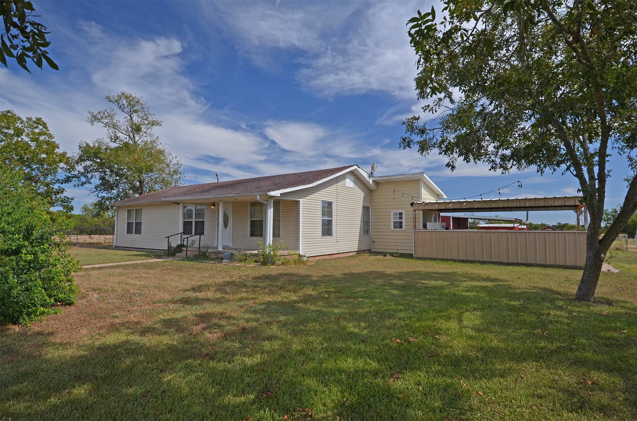 2352 Airport Road Brenham, TX 77833 - Photo 6 of 26 a front view of house with yard and trees in the background