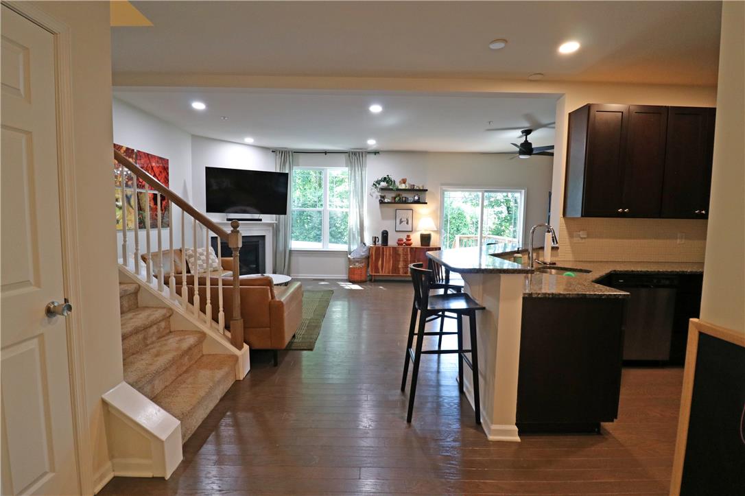 4502 Benjamin Court Emmaus, PA 18049 - Photo 7 of 53 An inviting open-concept layout unites the kitchen and living spaces, featuring lustrous hardwood flooring throughout.