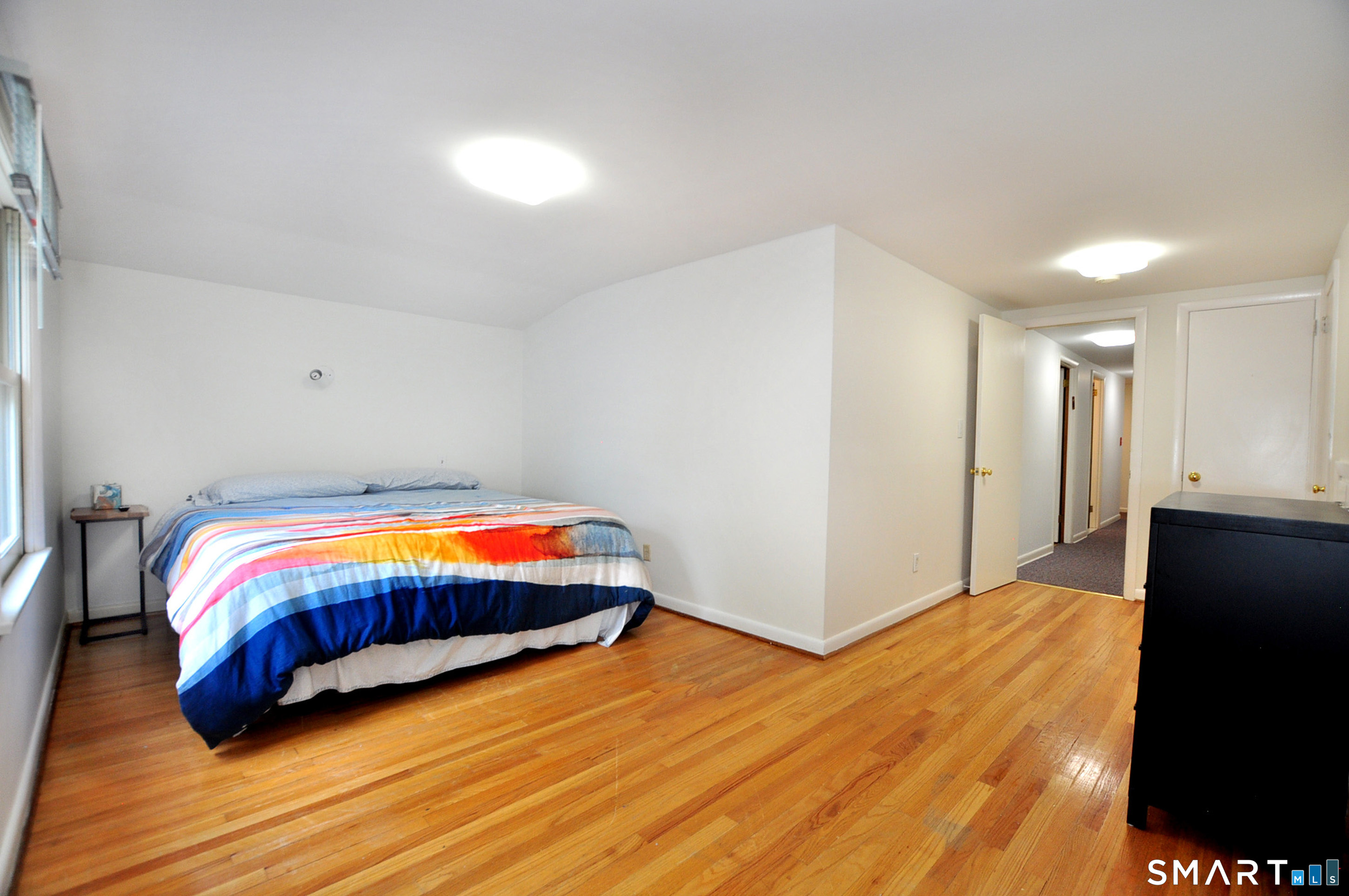 44 Miamis Road West Hartford, CT 06117 - Photo 32 of 39 a bedroom with a bed and wooden floor