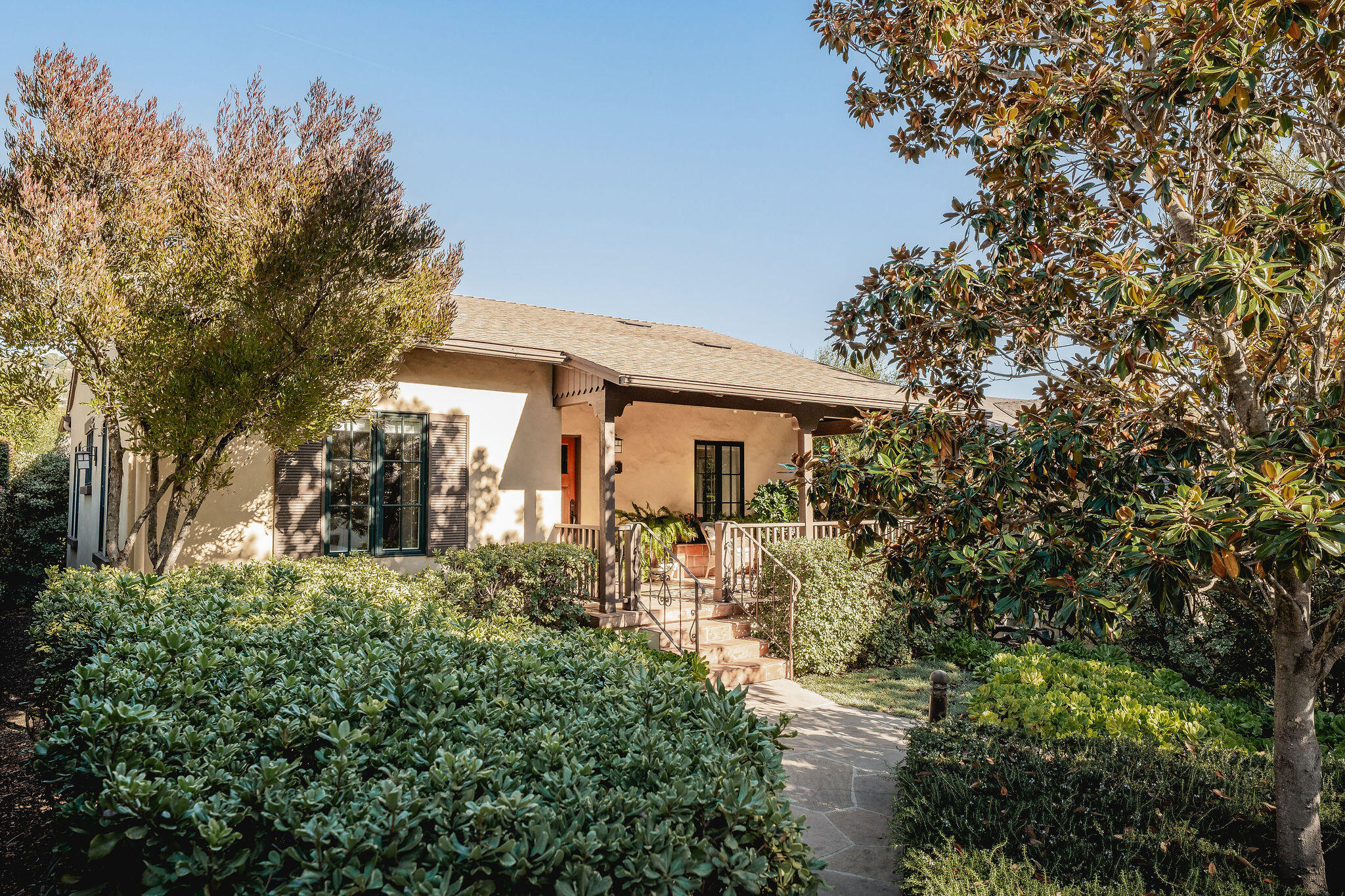 1436 Laguna Street Santa Barbara, CA 93101 - Photo 13 of 21 a front view of a house with a yard and fountain in middle