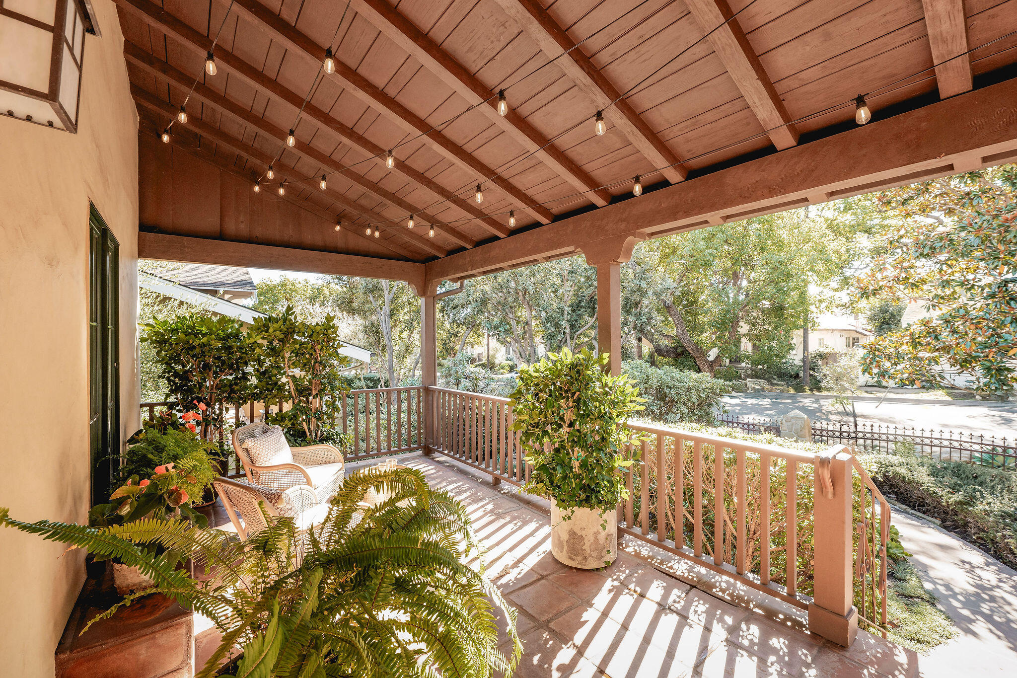 1436 Laguna Street Santa Barbara, CA 93101 - Photo 15 of 21 a view of a porch with furniture and wooden floor