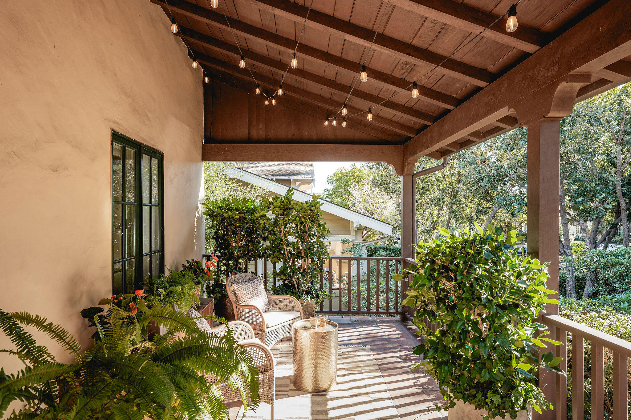 1436 Laguna Street Santa Barbara, CA 93101 - Photo 2 of 21 a porch with chairs and potted plants