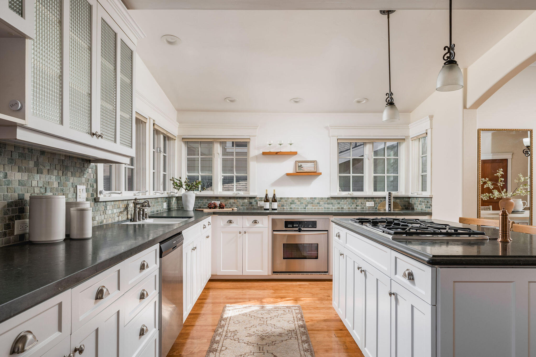 1436 Laguna Street Santa Barbara, CA 93101 - Photo 5 of 21 a kitchen with stainless steel appliances granite countertop a stove sink and cabinets