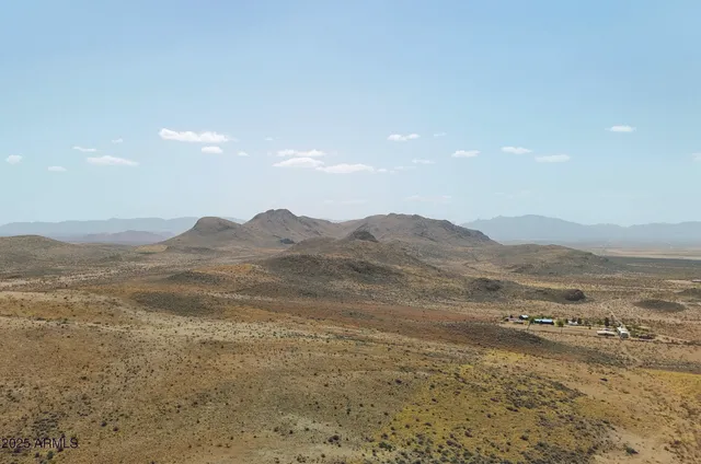 a view of an ocean and a mountain
