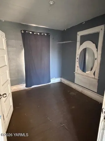 a view of a hallway with washer and dryer