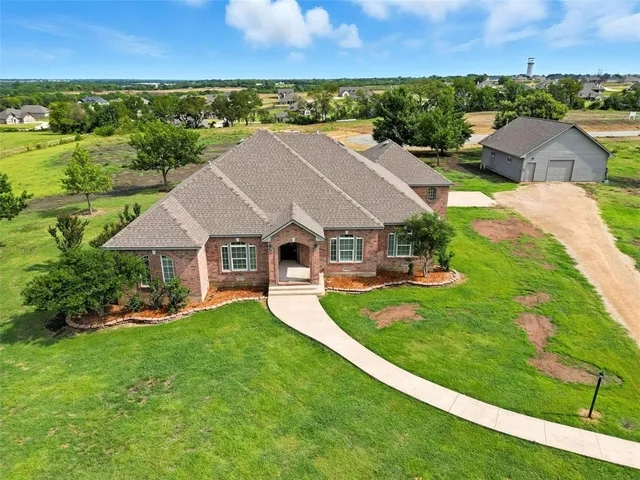 an aerial view of a house with a garden