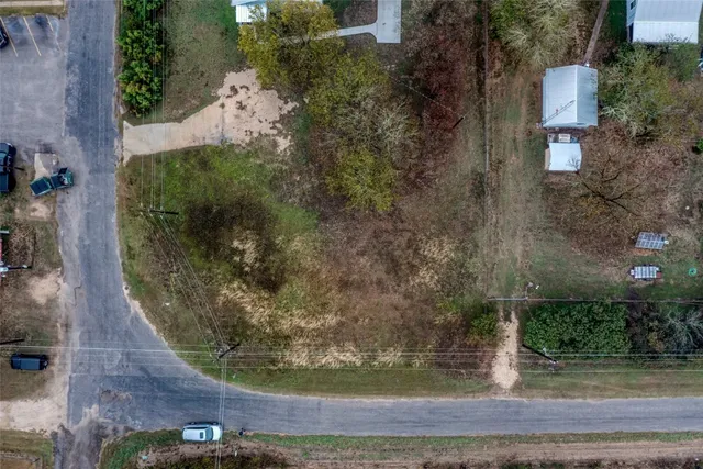 an aerial view of a residential houses with outdoor space
