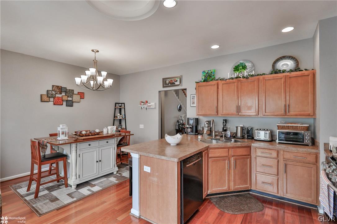 8550 Gateway Road Breinigsville, PA 18031 - Photo 17 of 50 a kitchen with granite countertop a sink stove and cabinets