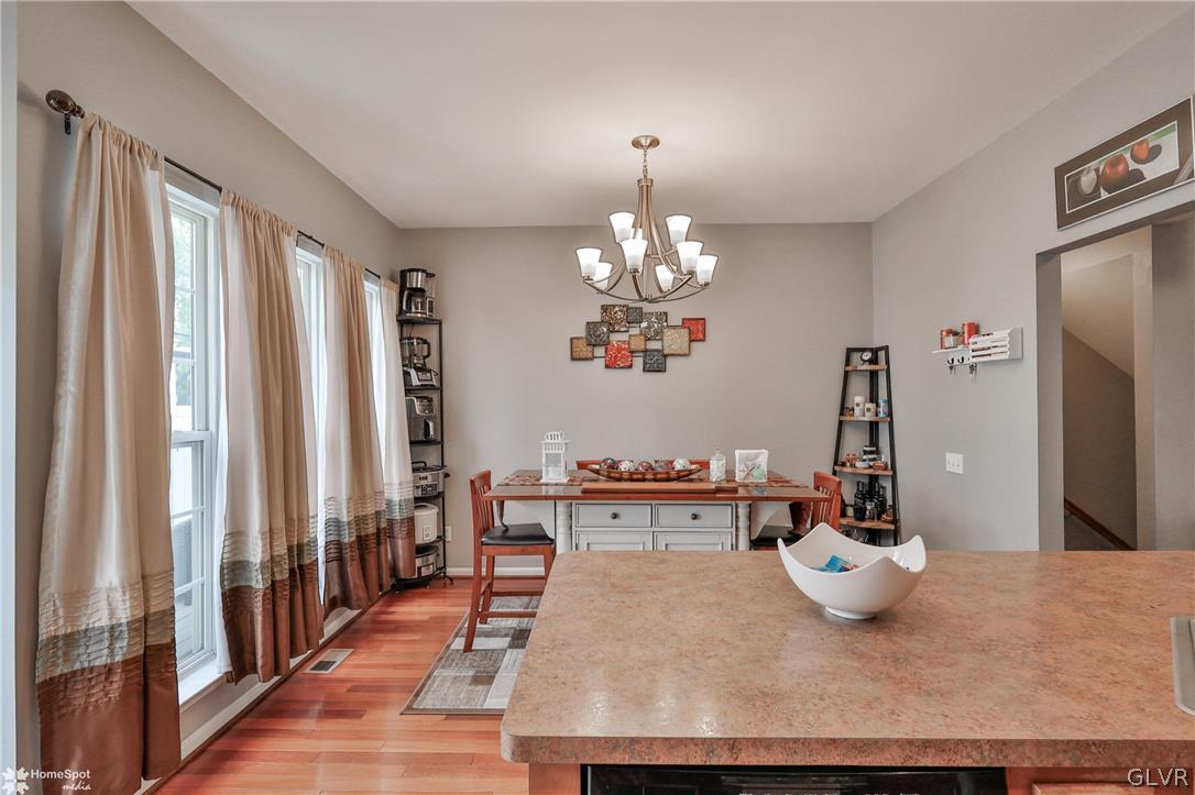 8550 Gateway Road Breinigsville, PA 18031 - Photo 18 of 50 a view of a dining room with furniture and a chandelier