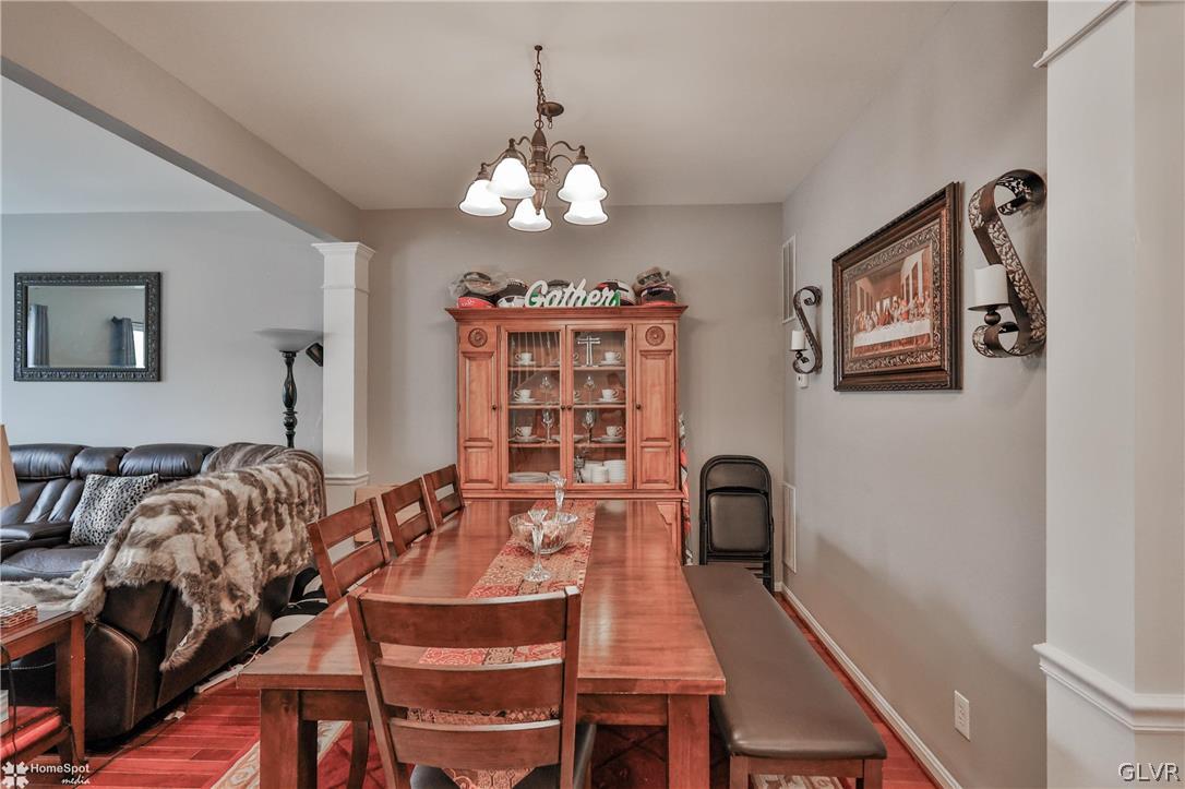 8550 Gateway Road Breinigsville, PA 18031 - Photo 21 of 50 a view of a dining room with furniture and chandelier