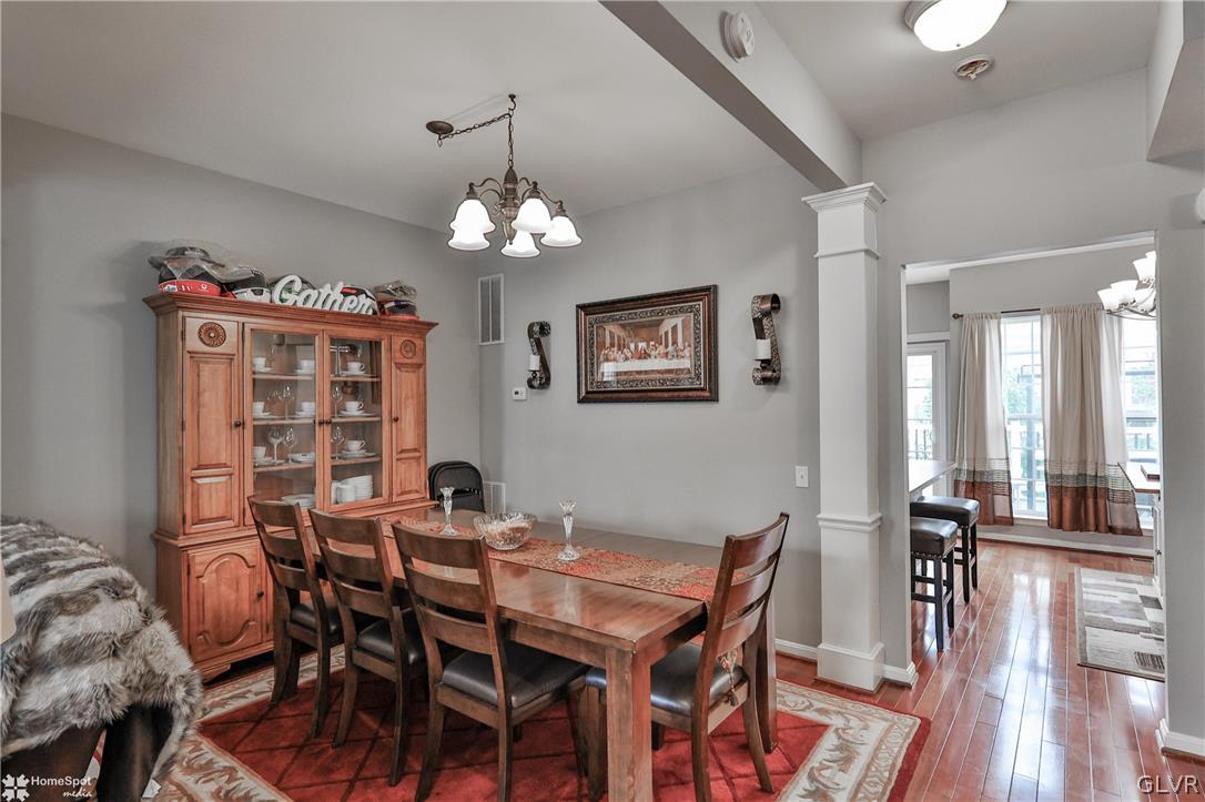 8550 Gateway Road Breinigsville, PA 18031 - Photo 22 of 50 a view of a dining room with furniture wooden floor and chandelier