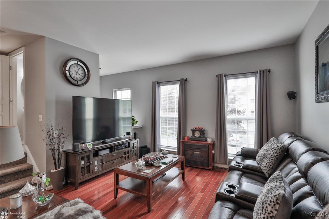 8550 Gateway Road Breinigsville, PA 18031 - Photo 27 of 50 a living room with furniture a flat screen tv and a window