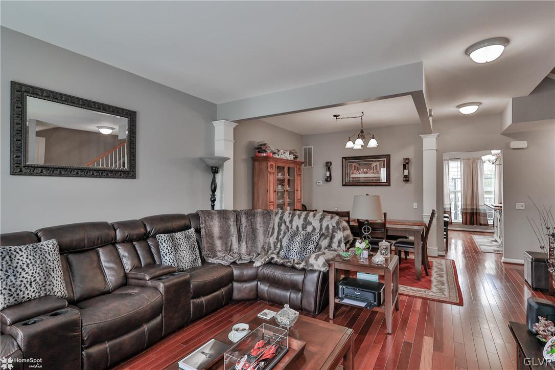 8550 Gateway Road Breinigsville, PA 18031 - Photo 28 of 50 a living room with furniture and wooden floor