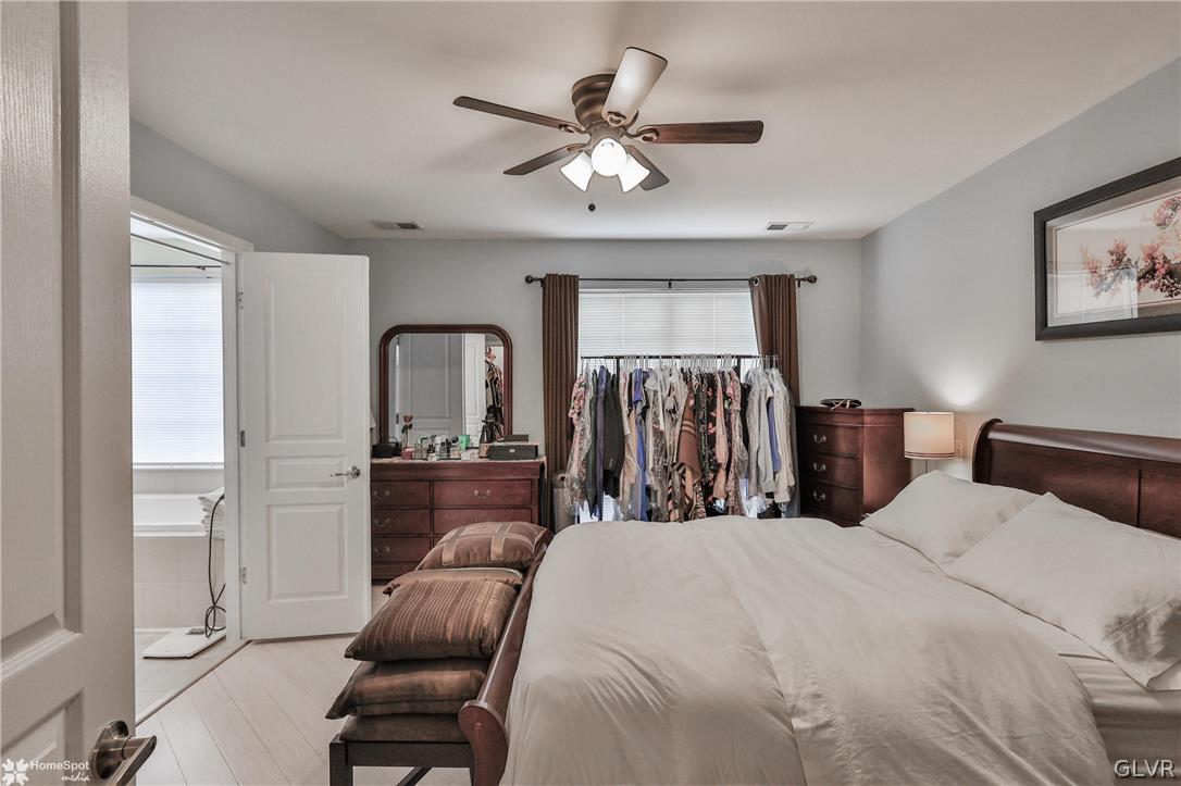 8550 Gateway Road Breinigsville, PA 18031 - Photo 31 of 50 a bed room with a bed and a ceiling fan