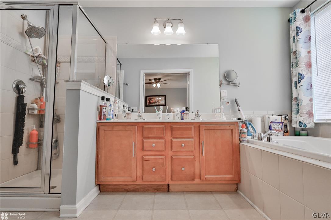 8550 Gateway Road Breinigsville, PA 18031 - Photo 37 of 50 a bathroom with a sink double vanity and a mirror