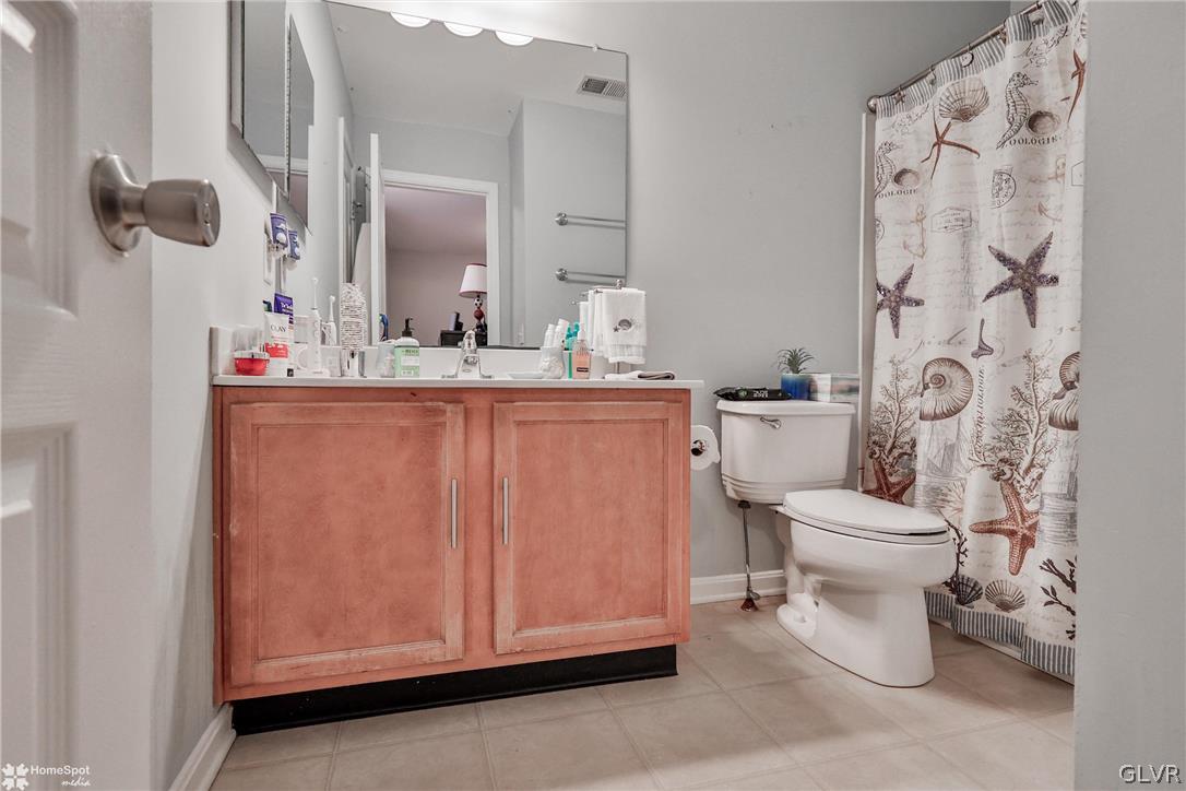 8550 Gateway Road Breinigsville, PA 18031 - Photo 39 of 50 a bathroom with a sink a toilet and a mirror