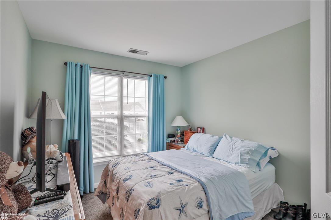 8550 Gateway Road Breinigsville, PA 18031 - Photo 43 of 50 a bed sitting in a bedroom next to a window