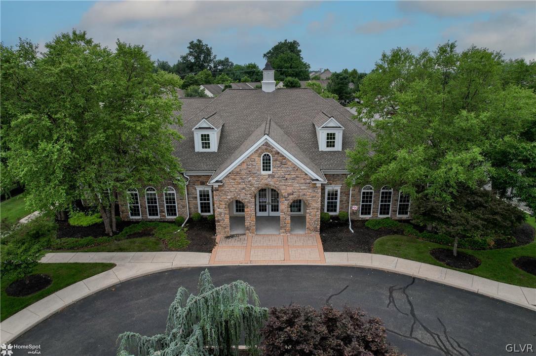 8550 Gateway Road Breinigsville, PA 18031 - Photo 49 of 50 a front view of a house with a garden and plants