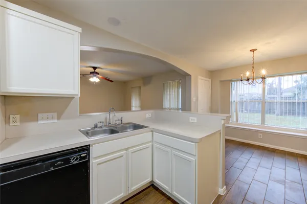 a kitchen with a sink and cabinets