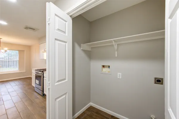 a view of walk in closet with window
