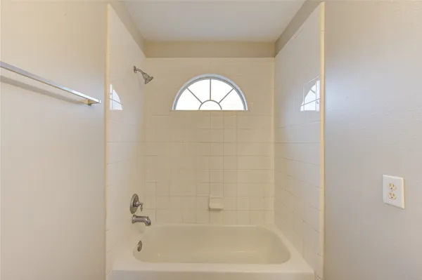 a close up of a bathtub in bathroom