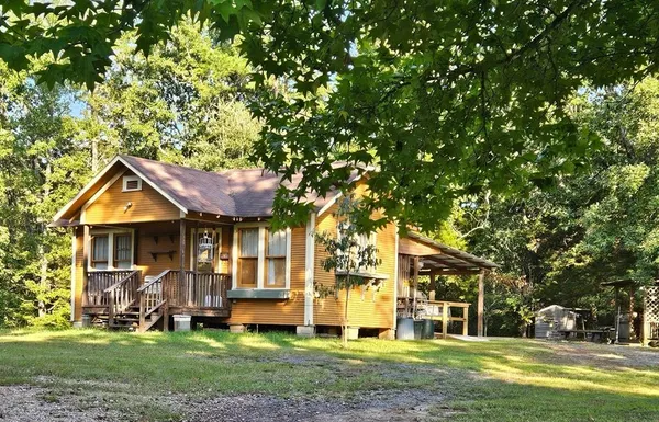 a view of a house with a tree