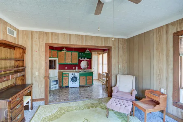 a living room with furniture and a window