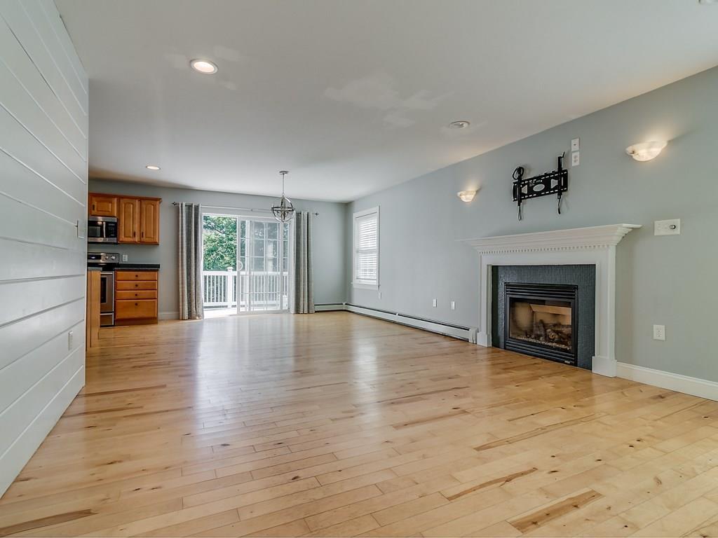 5 North Raymond Road Raymond, ME 04071 - Photo 13 of 33 Open living room with gas fireplace