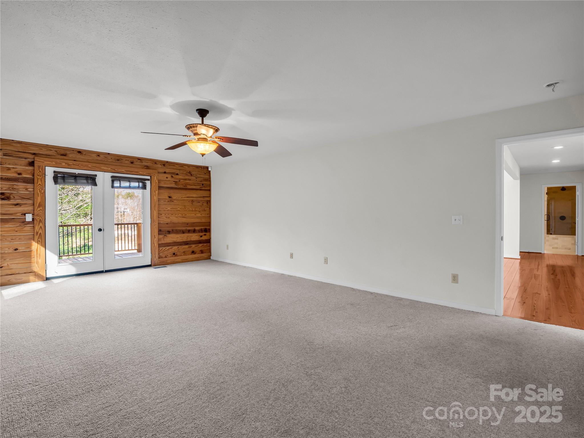 134 Raleigh Drive Lake Lure, NC 28746 - Photo 12 of 45 a view of a livingroom with a ceiling fan and window