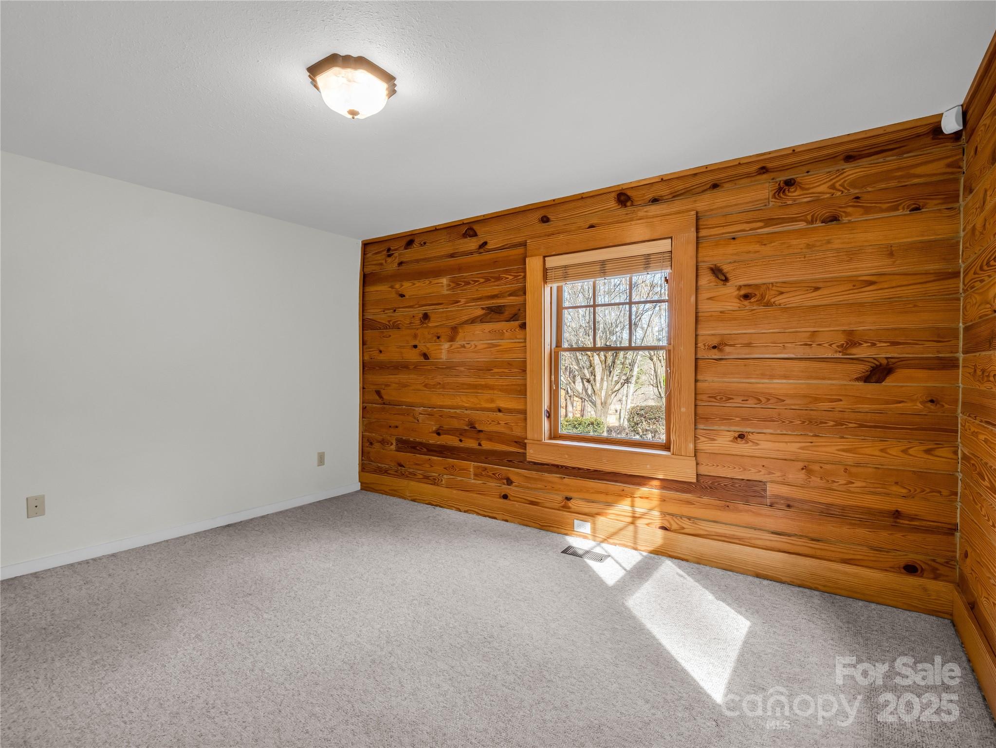 134 Raleigh Drive Lake Lure, NC 28746 - Photo 21 of 45 a view of an empty room with a window