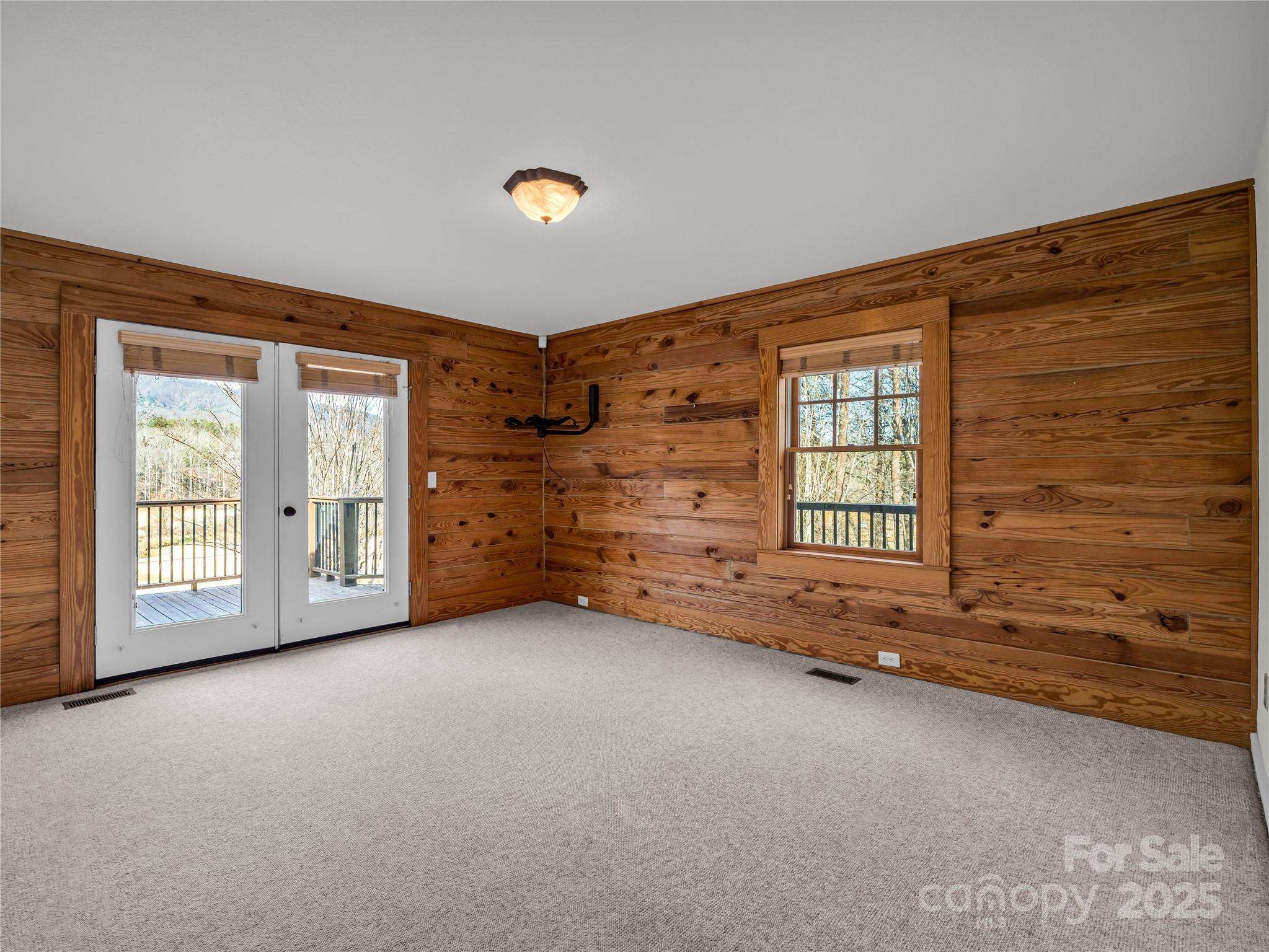 134 Raleigh Drive Lake Lure, NC 28746 - Photo 24 of 45 a view of an empty room with a window