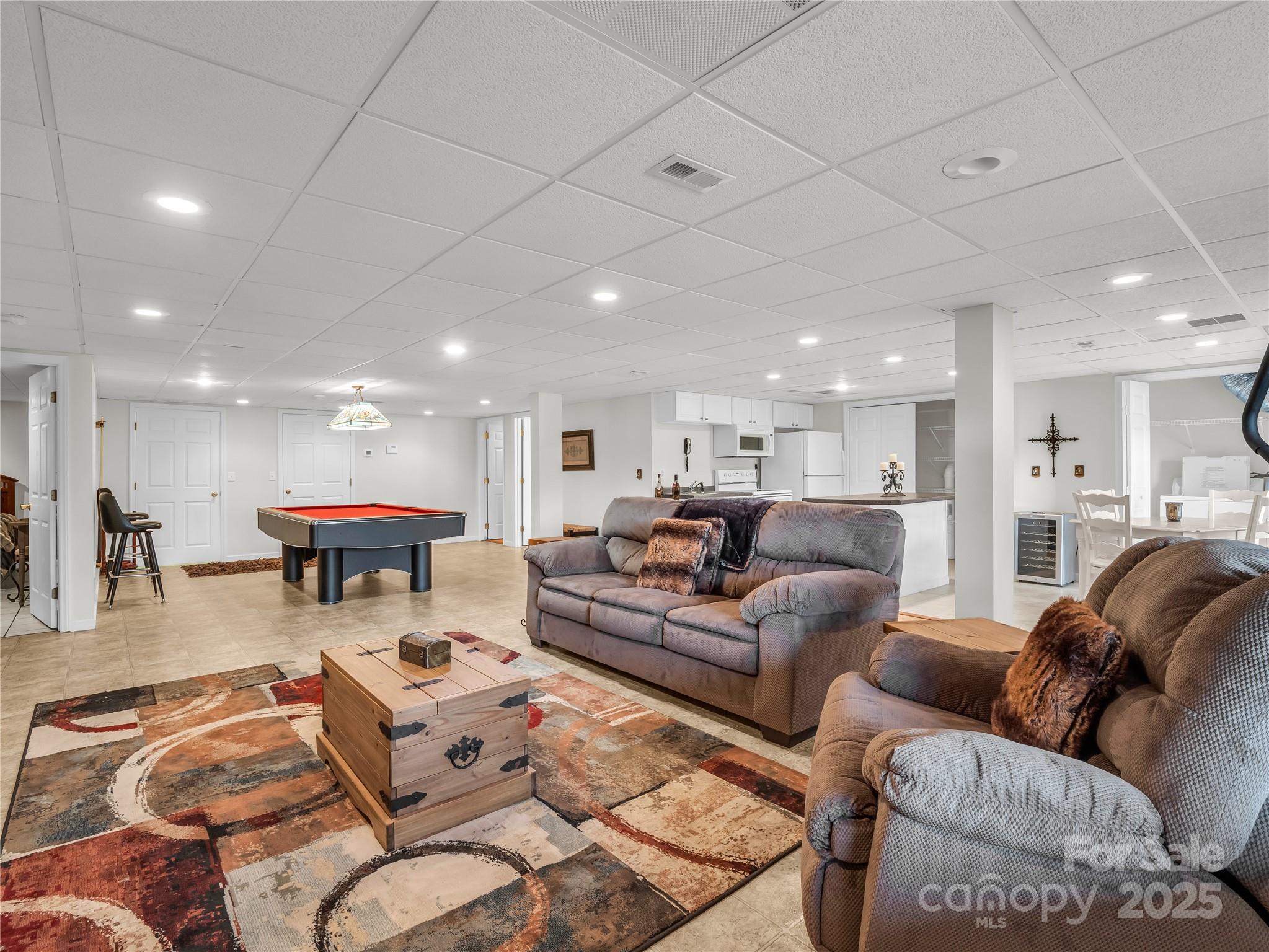 134 Raleigh Drive Lake Lure, NC 28746 - Photo 31 of 45 a living room with furniture kitchen view and a table