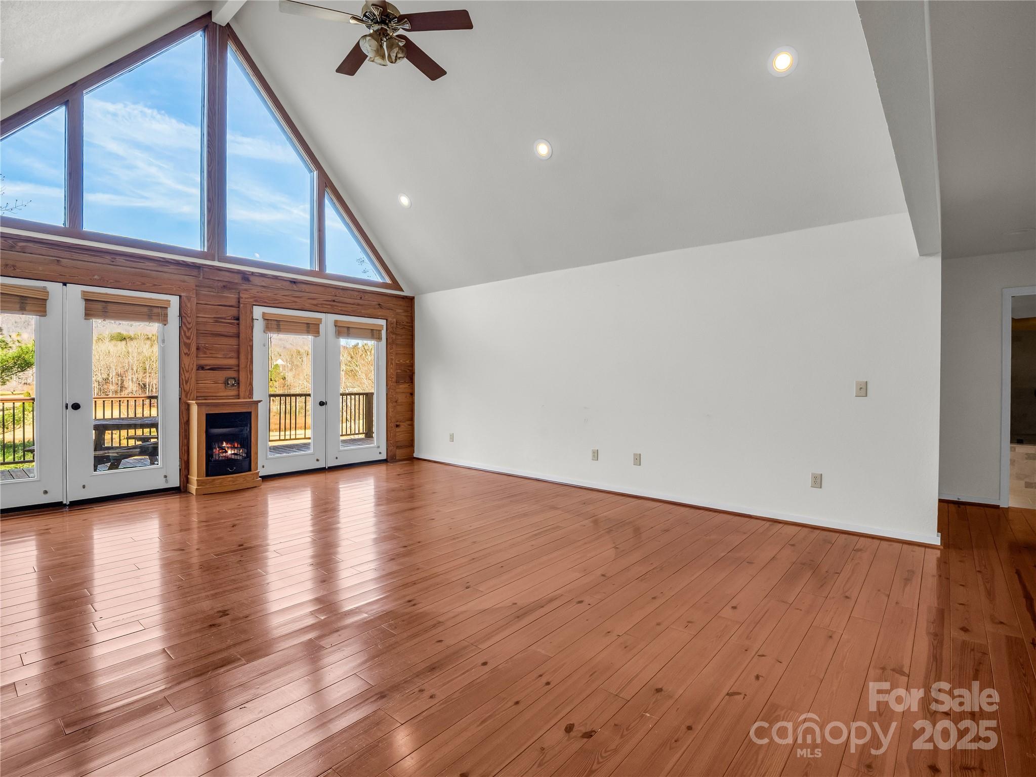 134 Raleigh Drive Lake Lure, NC 28746 - Photo 4 of 45 wooden floor in an empty room with a window