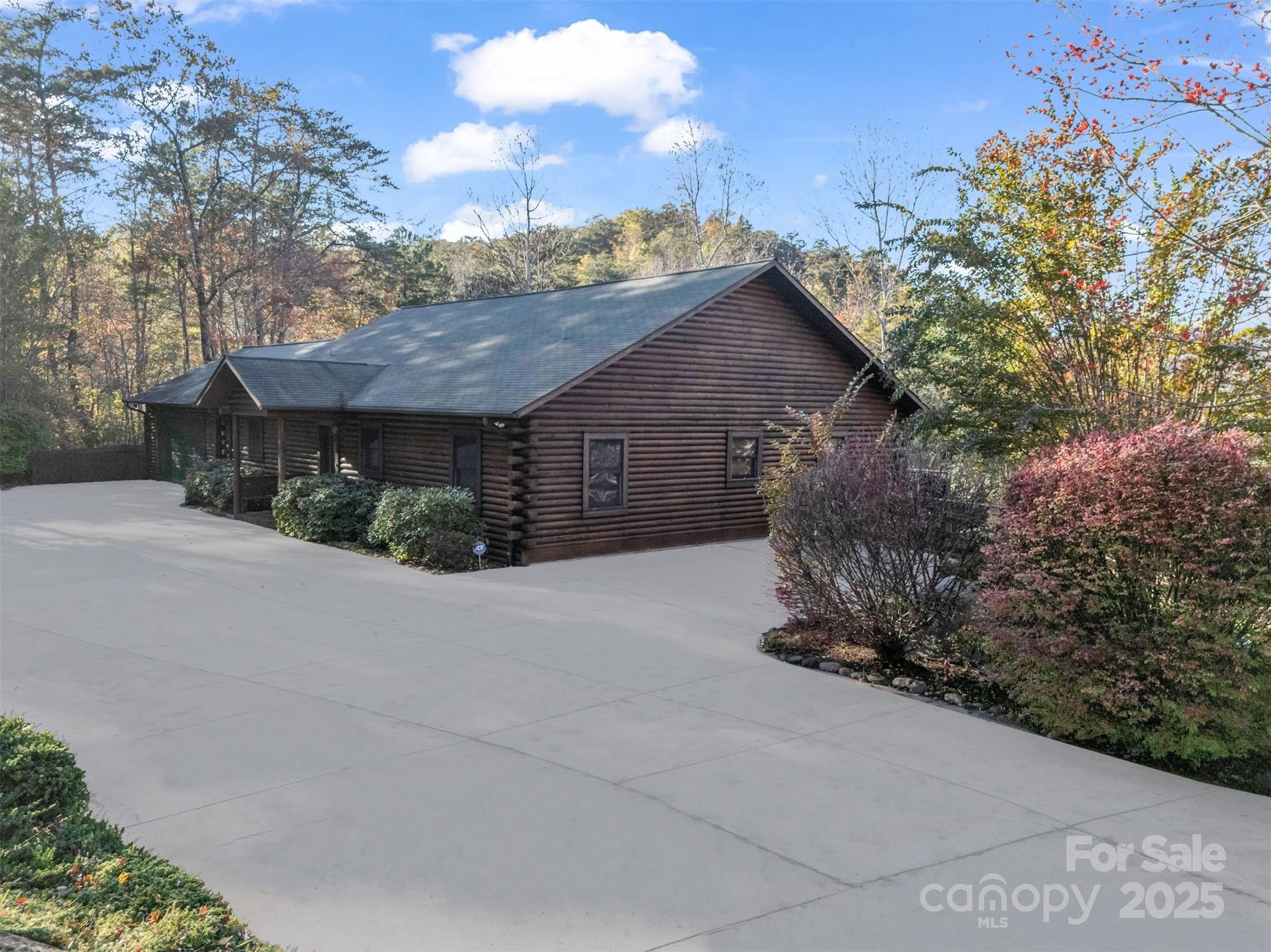 134 Raleigh Drive Lake Lure, NC 28746 - Photo 45 of 45 a view of a house with a yard and garage