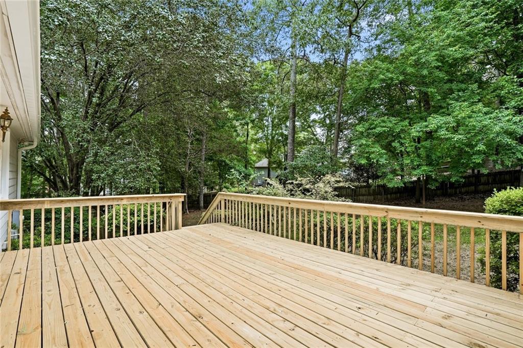13 Bedford Ridge Northwest Cartersville, GA 30121 - Photo 15 of 19 a balcony with wooden floor and fence