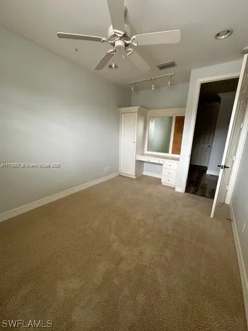 a view of a hallway view with staircase