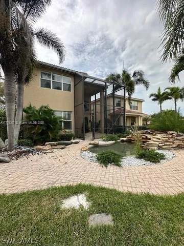 a view of a swimming pool with a table and chairs