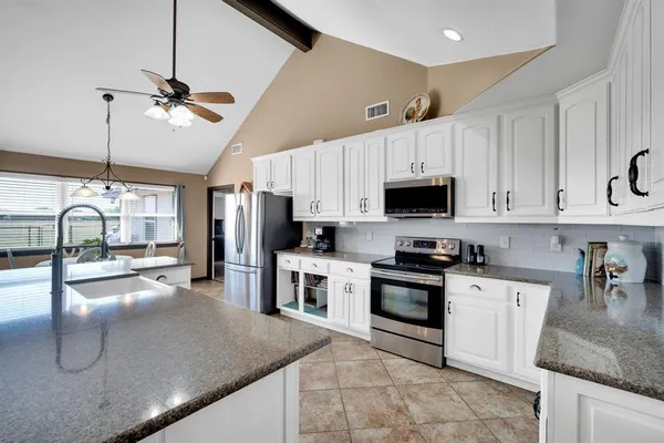 a dining room with furniture window and outside view