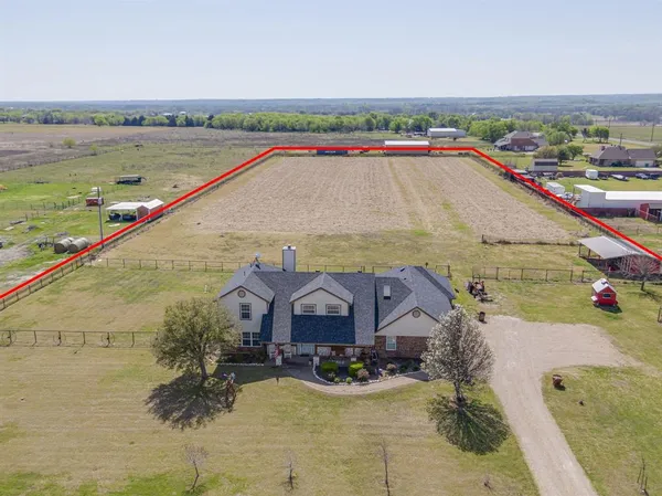 an aerial view of houses with outdoor space