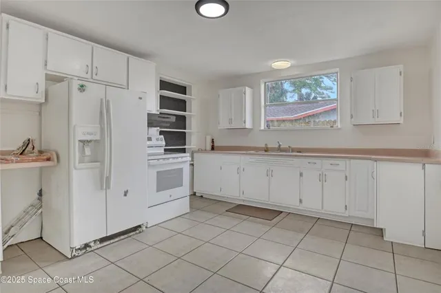 a view of a kitchen with cabinets