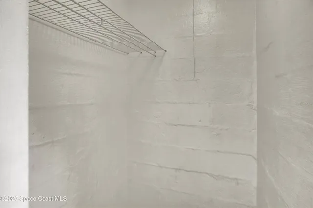 a view of room with window and furniture