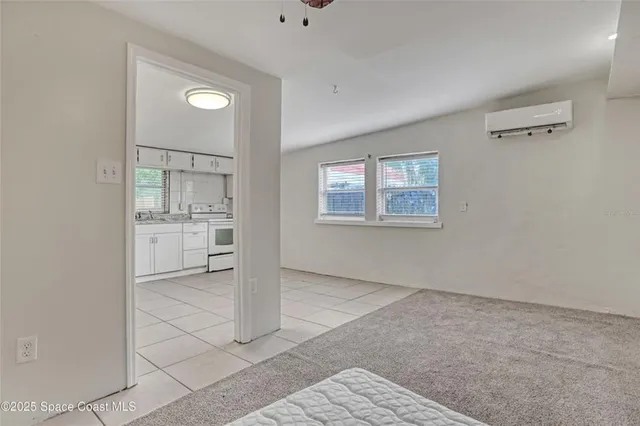 a bathroom with a shower and a window
