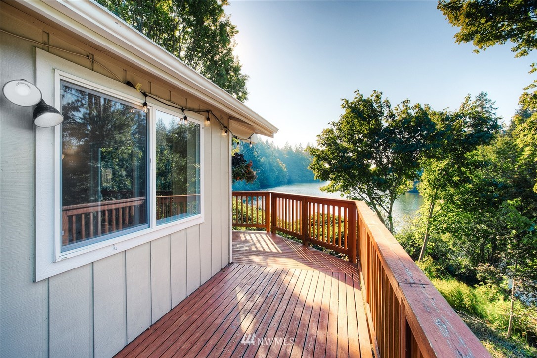 19605 Whiteman Cove Road Southwest Lakebay, WA 98351 - Photo 14 of 40 a balcony with wooden floor and outdoor space