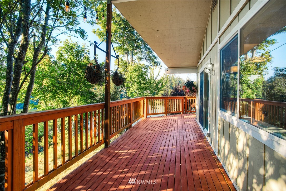 19605 Whiteman Cove Road Southwest Lakebay, WA 98351 - Photo 15 of 40 a view of balcony with wooden floor