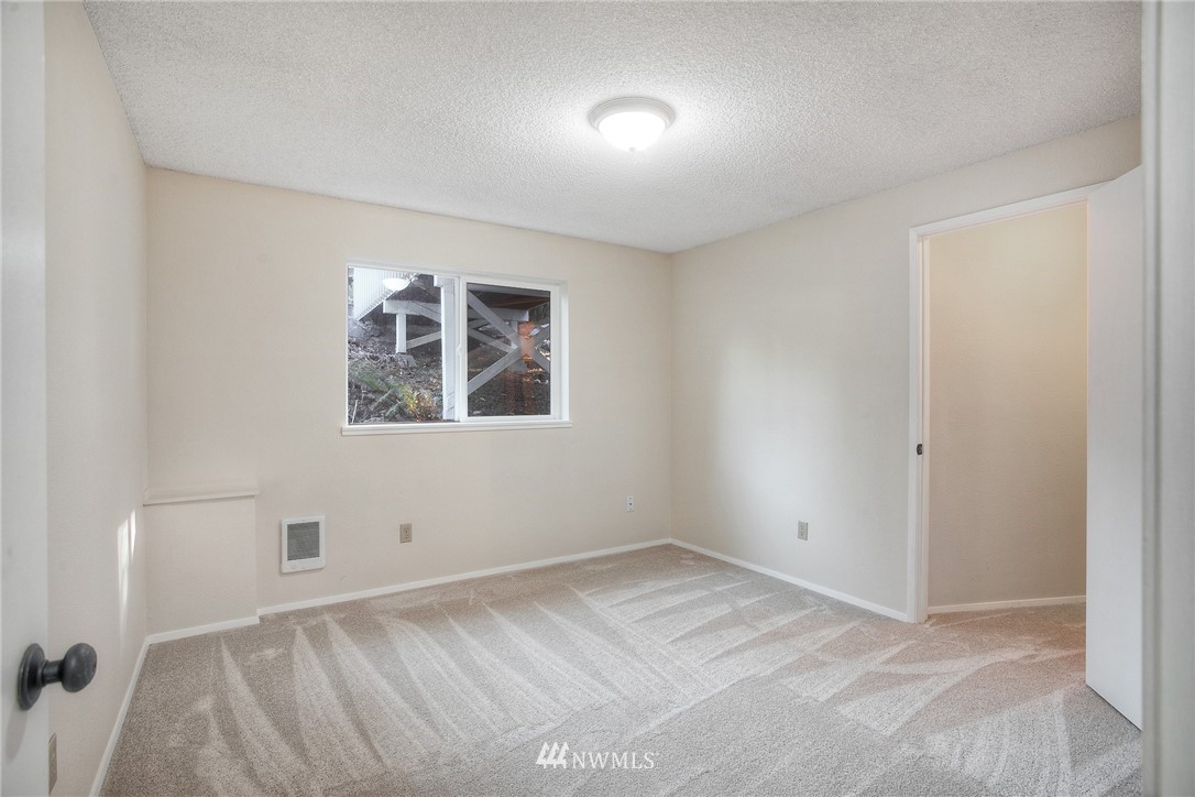19605 Whiteman Cove Road Southwest Lakebay, WA 98351 - Photo 21 of 40 an empty room with windows