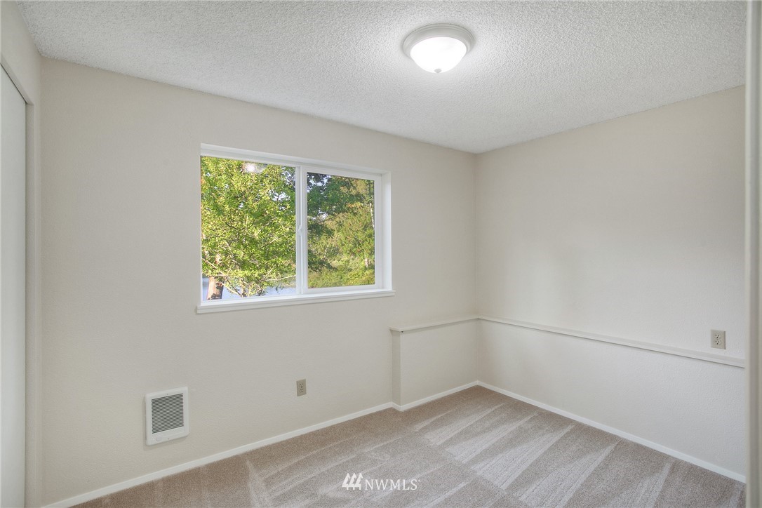 19605 Whiteman Cove Road Southwest Lakebay, WA 98351 - Photo 23 of 40 an empty room with a window