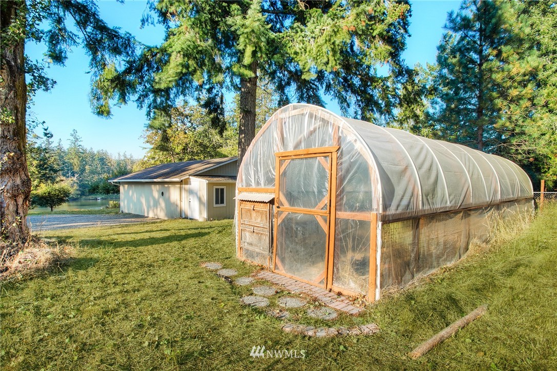 19605 Whiteman Cove Road Southwest Lakebay, WA 98351 - Photo 26 of 40 a view of a backyard with basket ball court
